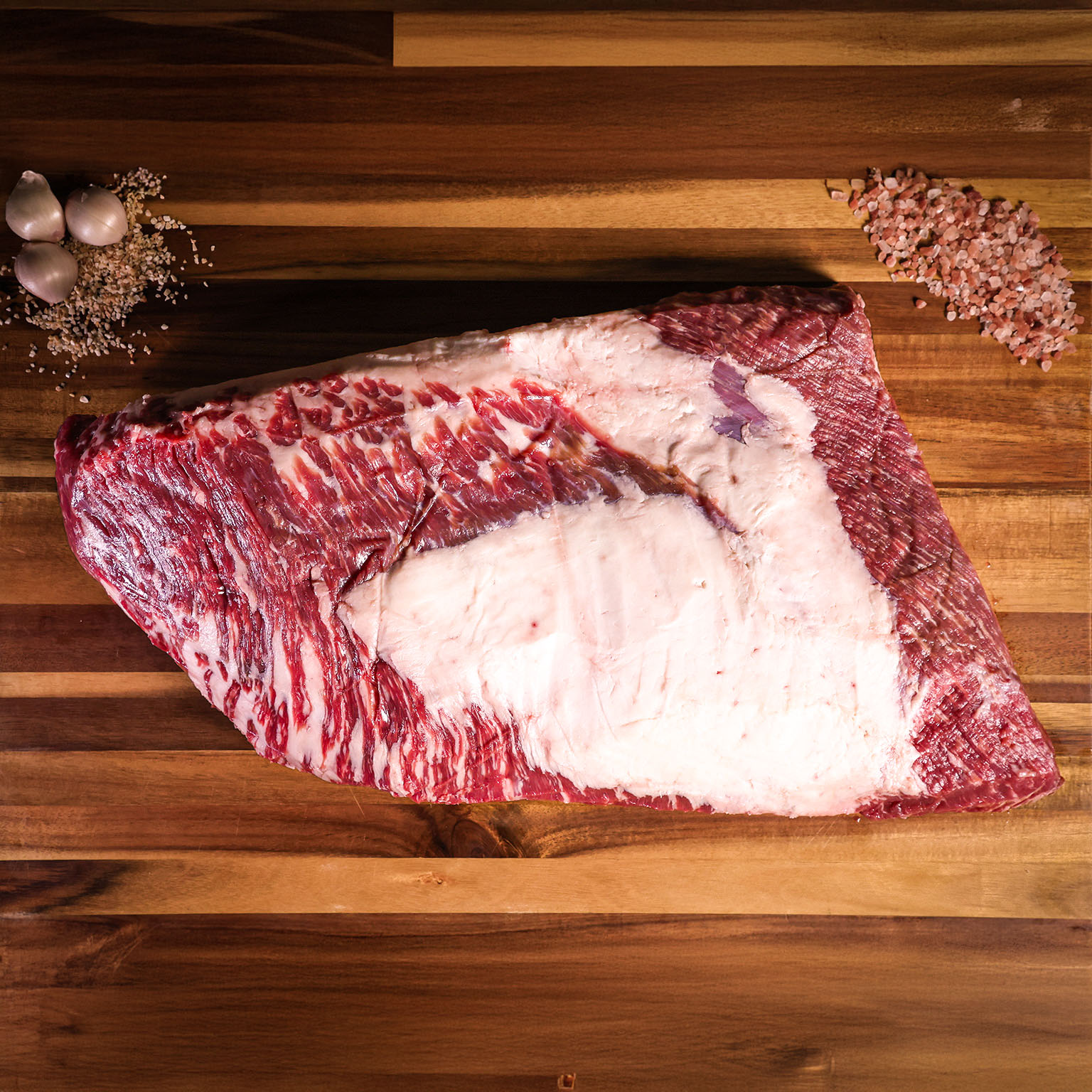 Smoked Akaushi Wagyu brisket sliced to reveal a deep pink smoke ring
